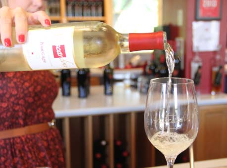 Pouring a glass of Muscardini White Wine